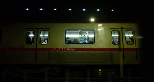 Man on train in Beijing
